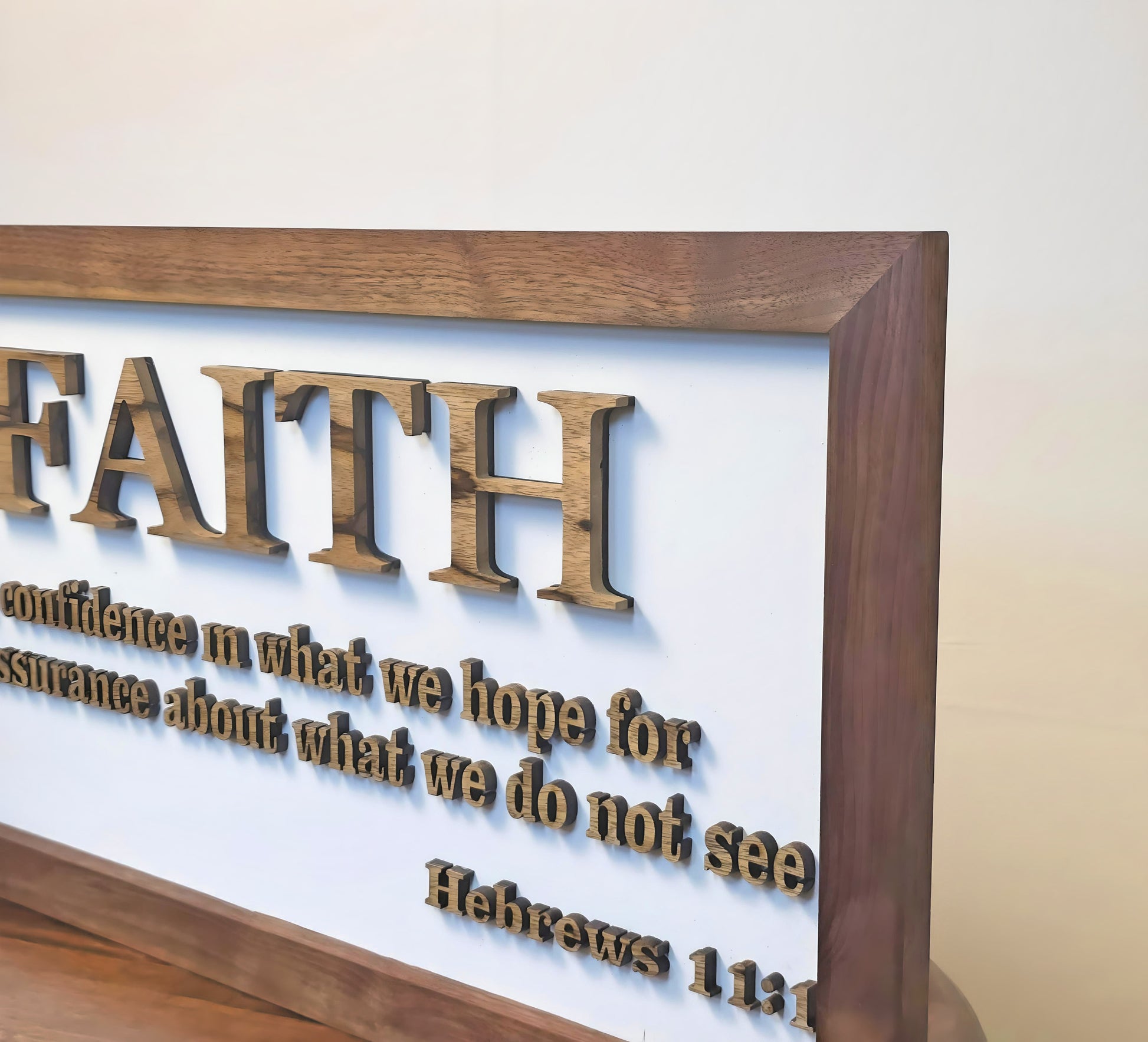Decorative sign with 'FAITH' definition in a wooden frame on a light background
Handcrafted exotic wood Faith sign – 24x12 scripture wall art with laser-cut letters”

Rustic Christian home décor – wooden wall sign with natural wood frame
